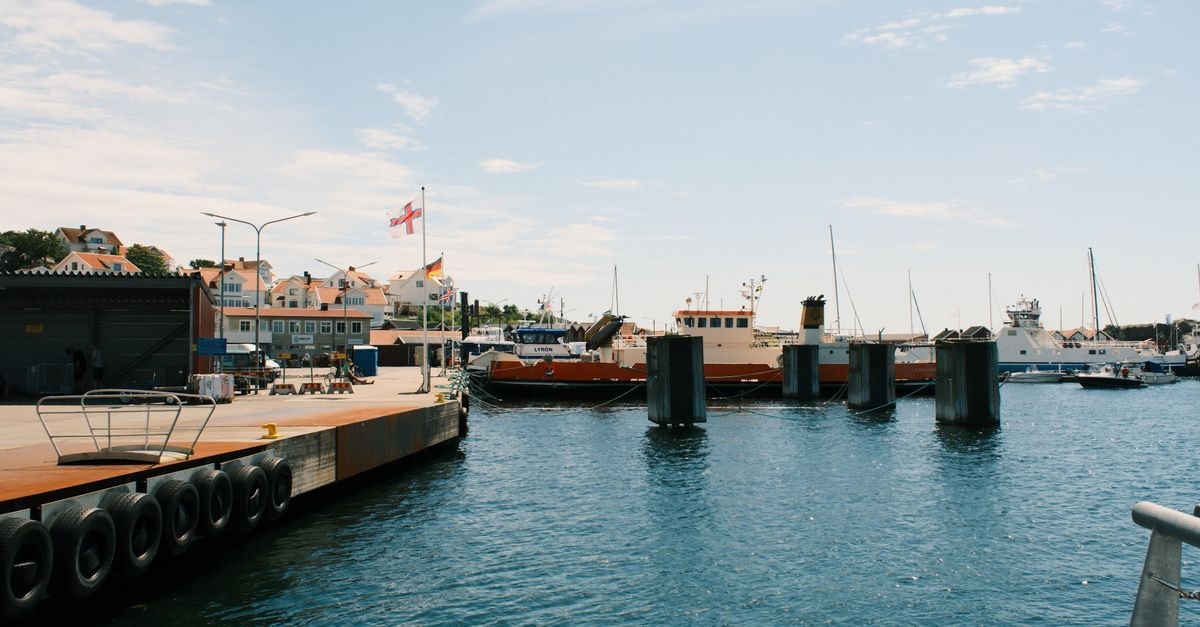 Charming harbor view featuring boats and coastal architecture in a Swedish town.