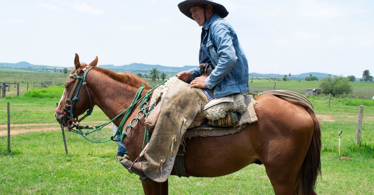 Slow Days in San Juan Bautista: A Paraguay Travel Guide A Paraguayan cowboy on horseback in Misiones countryside, portraying rural life and tradition.