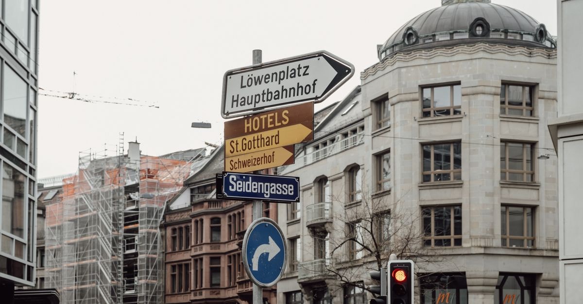 Explore Zurich's urban charm with detailed signage and architecture in this city scene.