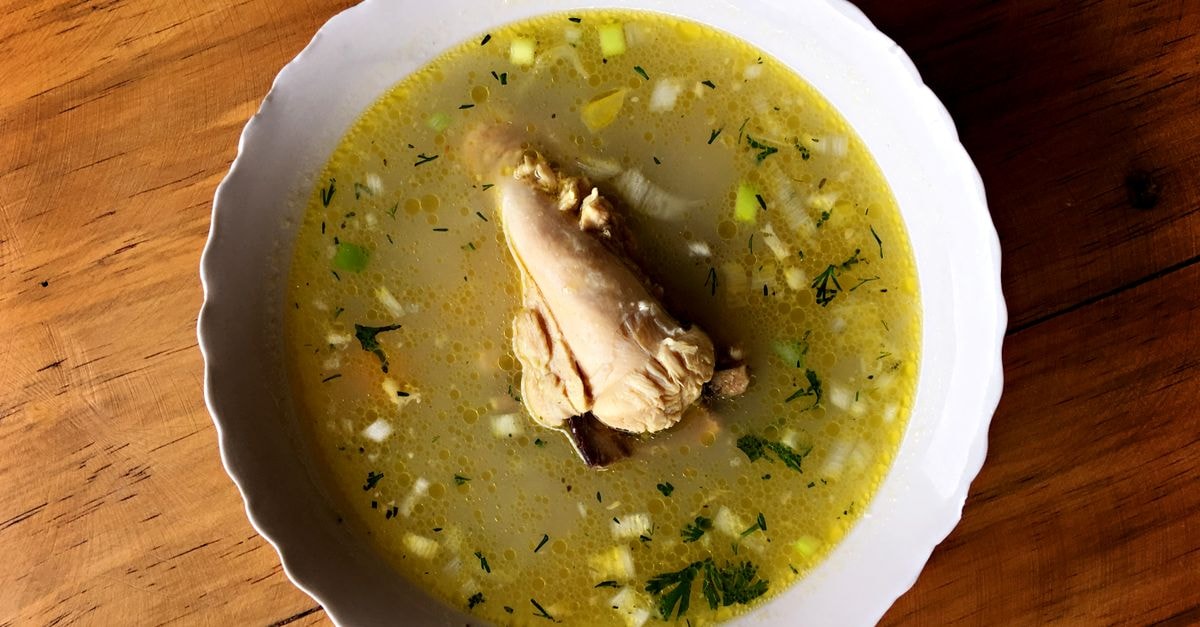 Basarabeasca Travel Guide: Attractions and Moldovan Food Delicious Ecuadorian chicken soup with vegetables in a white bowl, perfect for a comforting meal.