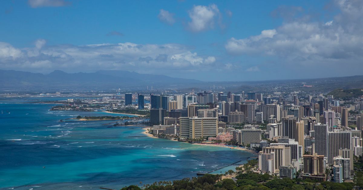 BINI drops 'Forgotten Island' track 'A Parallel World'; Moana's Opetaia Foa'i earns APRA Billions Award Stunning aerial view of Honolulu's skyline with vibrant ocean hues and lush greenery.