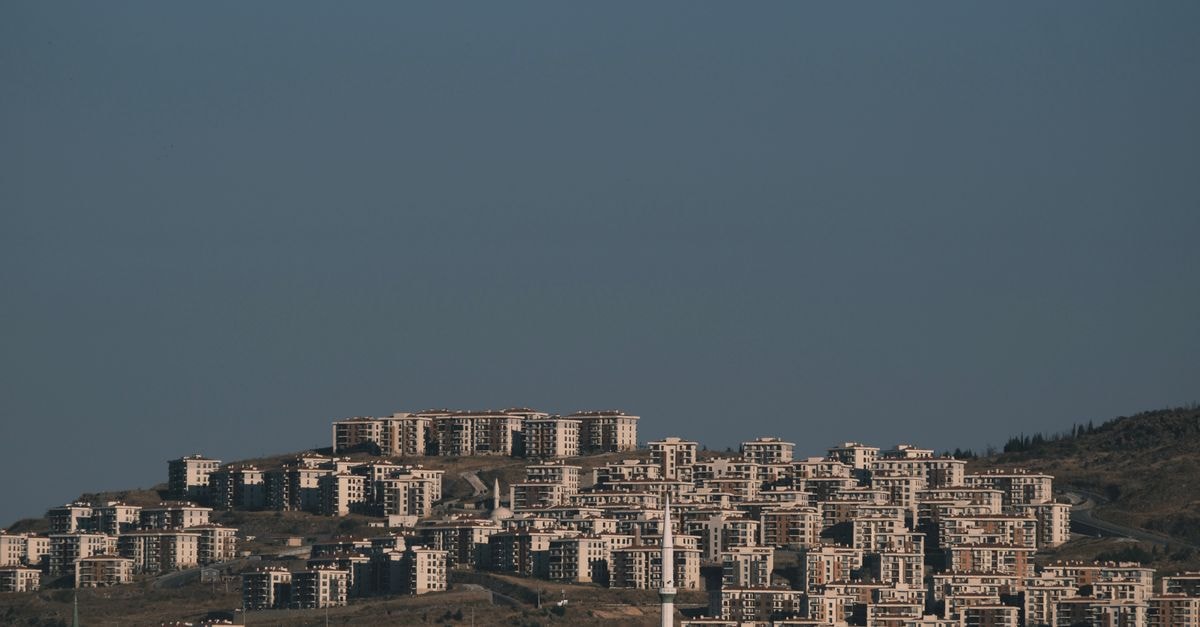7Days Inn Hulun Buir Shengli Street, Hulunbuir — Inner Mongolia City Base Panoramic view of densely packed residential buildings on a hill in Izmir, Türkiye.