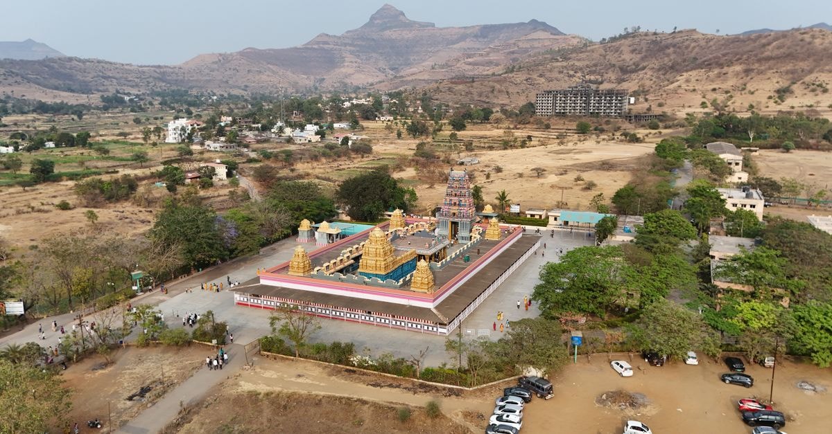 Malegaon Travel Guide: Planning Tips, Costs and Things to Do Explore the stunning aerial view of a temple nestled in the picturesque Raigad valley, Maharashtra.