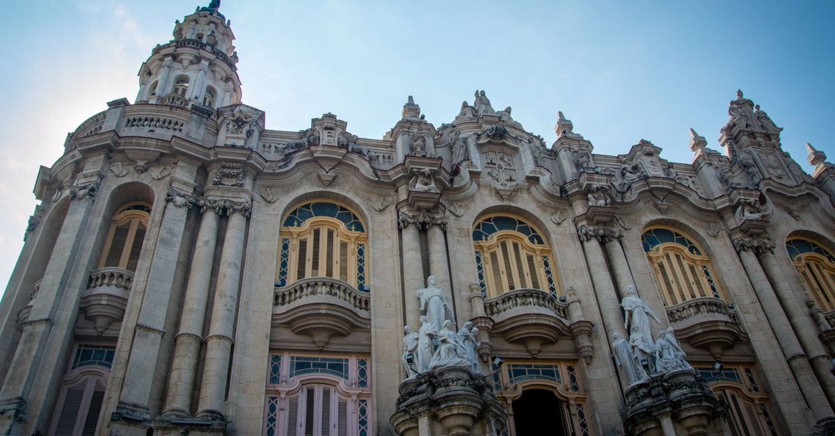 Stunning baroque architectural facade in Havana, Cuba under a clear blue sky.