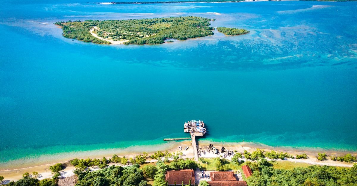 Geita travel guide: a quiet lake-region stop in northwestern Tanzania Stunning aerial view showcasing the coastline of Bagamoyo, Pwani Region, Tanzania with lush greenery and a deep blue ocean.