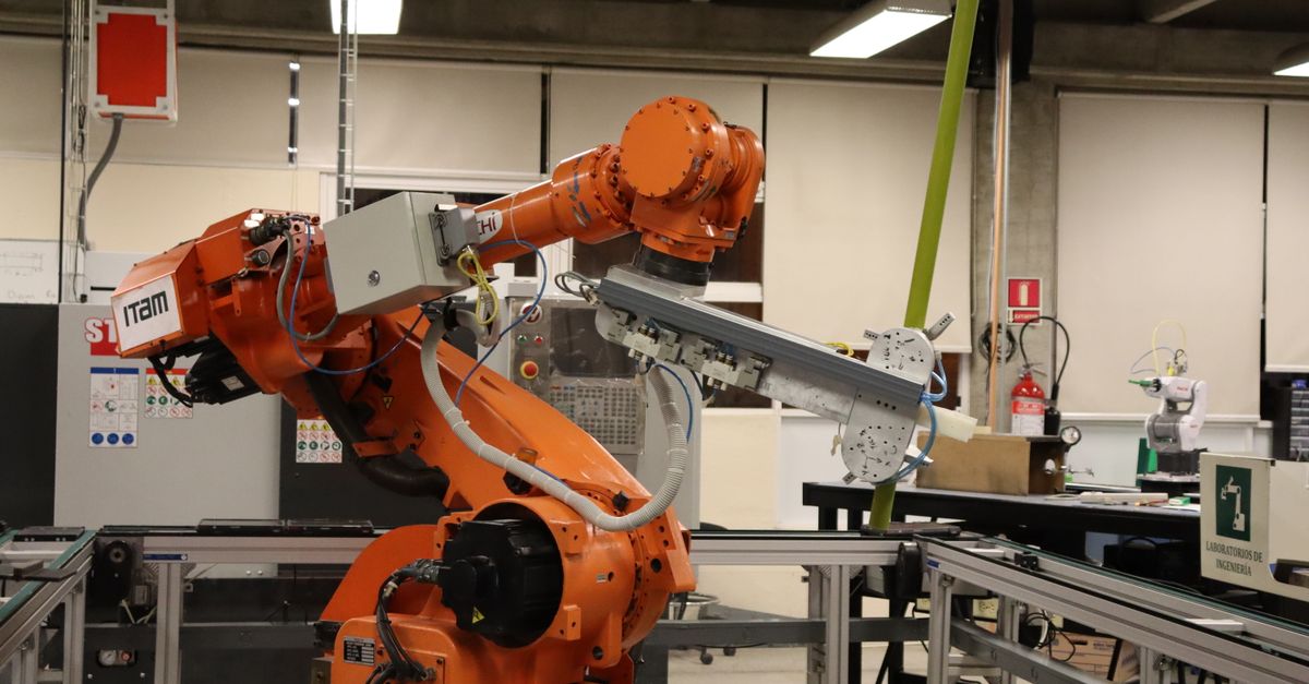 Humanoid Robots Move From Labs to Chinese Factory Floors and South Korean Naval Bridges Industrial robotic arm in a Ciudad de México lab setting, showcasing automation technology.