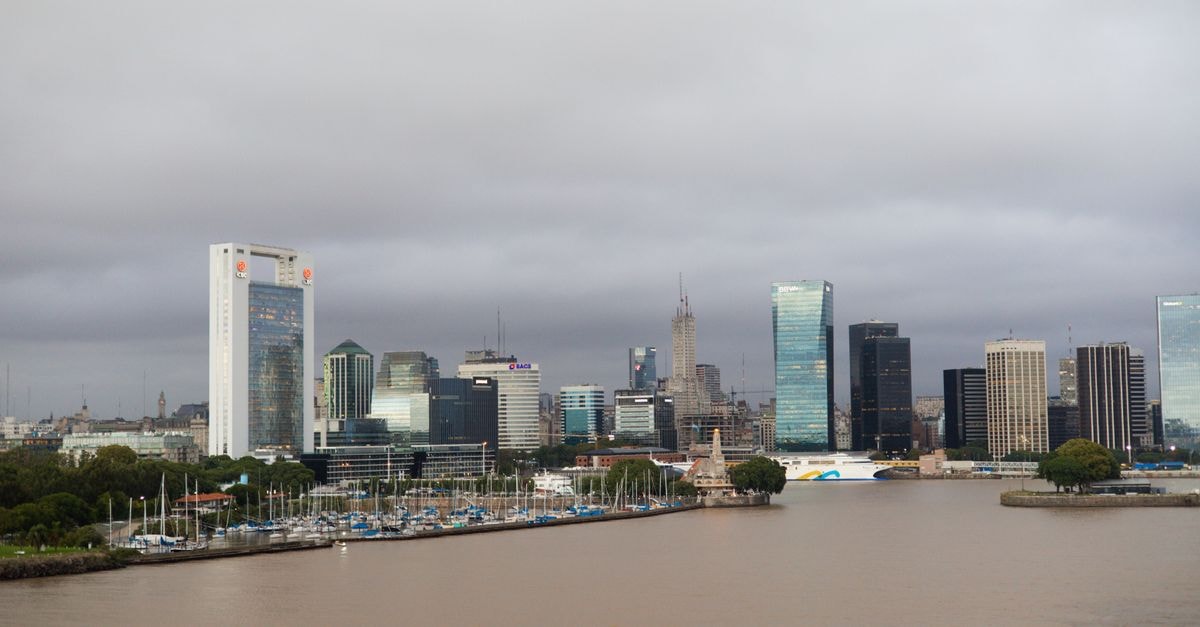 Dazzler by Wyndham La Plata: Cathedral-Front Stays in Downtown La Plata Skyline of Buenos Aires with modern buildings and docklands under a cloudy sky.