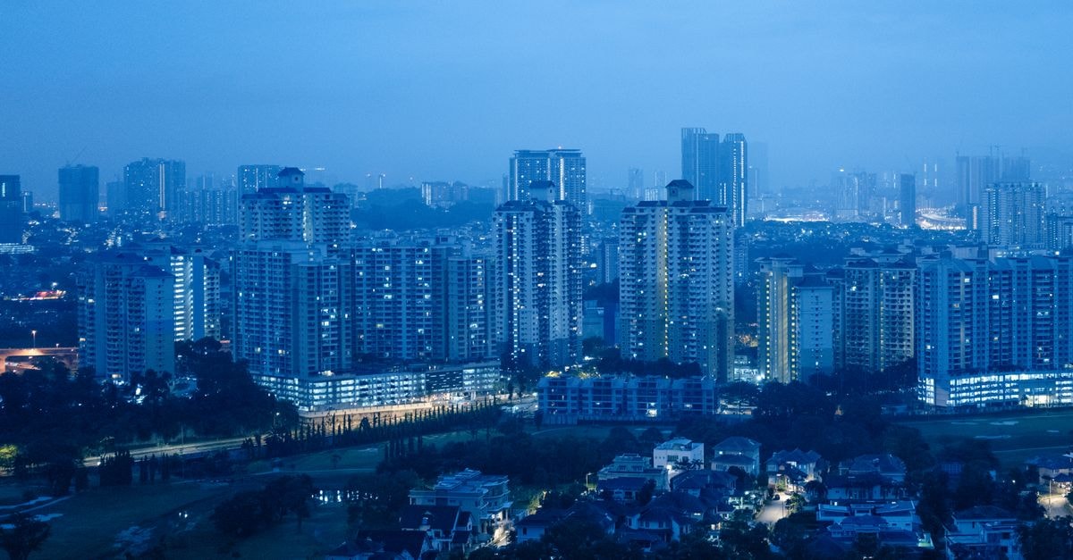 Hotel Seri Malaysia Seremban: Hilltop Stay in Negeri Sembilan Peaceful view of Kuala Lumpur's skyline during blue hour with city lights.