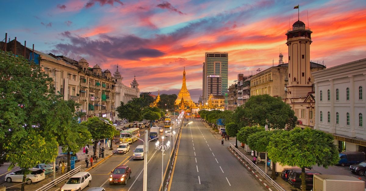 Bodhi Nava in Yangon: A Boutique Hostel & Café in Bahan Stunning view of Sule Pagoda in Yangon during sunset, capturing vibrant city life.