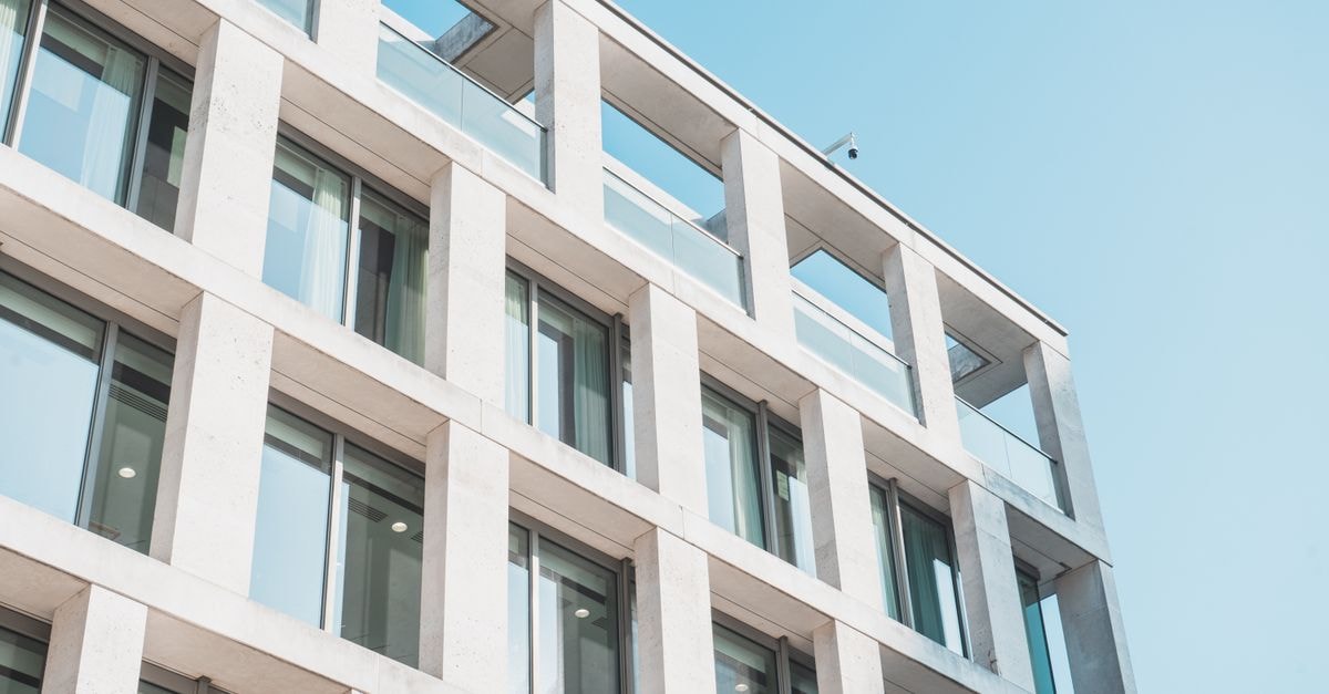 O'Reilly Automotive: A Quality Operator at a Rich Multiple Contemporary office building with glass and concrete design, viewed from a low angle against the sky.