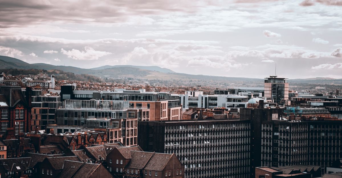 DoubleTree by Hilton Hotel Glasgow Central in Glasgow: A Short Stroll From Glasgow's Stage Door Aerial view of Edinburgh's cityscape under a dramatic, cloudy sky.