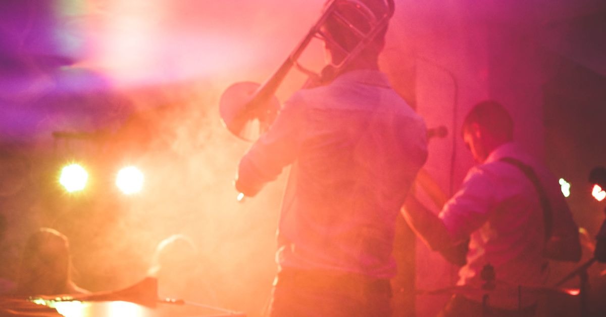 Angine de Poitrine Sweeps Polaris Music Prize and SOCAN Song Prize Vibrant live music performance featuring a trombone player on stage in a nightclub setting.