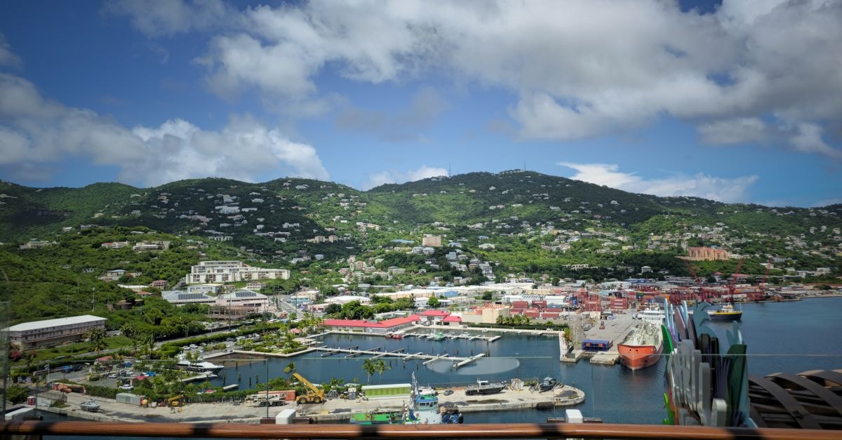 Le Beach Hotel, Marigot — A Caribbean-Bay Address on Saint Martin Aerial view of Charlotte Amalie Harbor in St. Thomas with vibrant buildings and lush green hills.