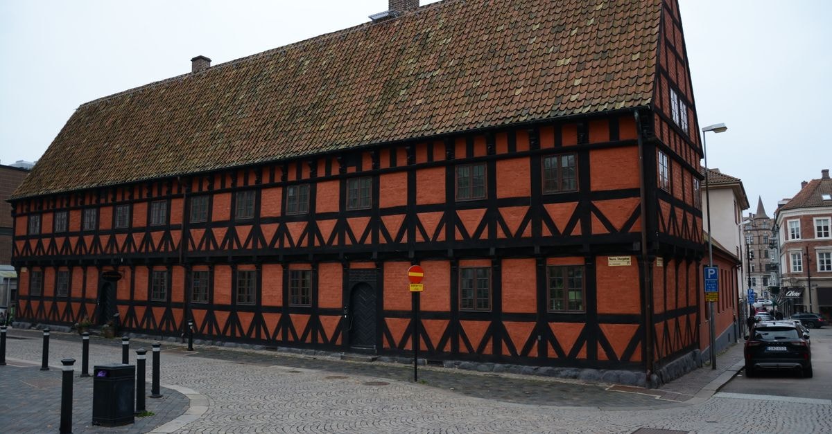 Odense Travel Guide: A Fairytale City Reimagined A historic half-timbered building with red bricks in a European city. Classic architecture.