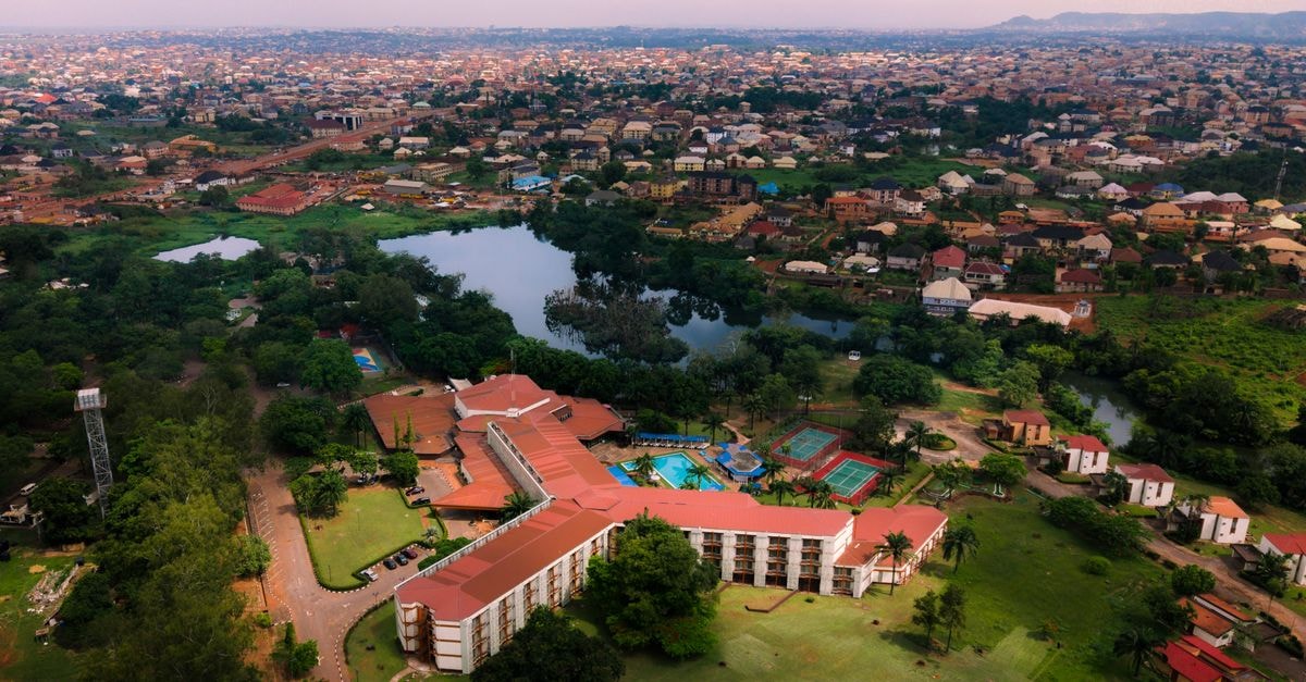 CEPRODILIC, Bujumbura — A Central Guest House Worth Knowing Aerial view of Enugu, Nigeria showcasing urban landscape, lush greenery, and residential structures.