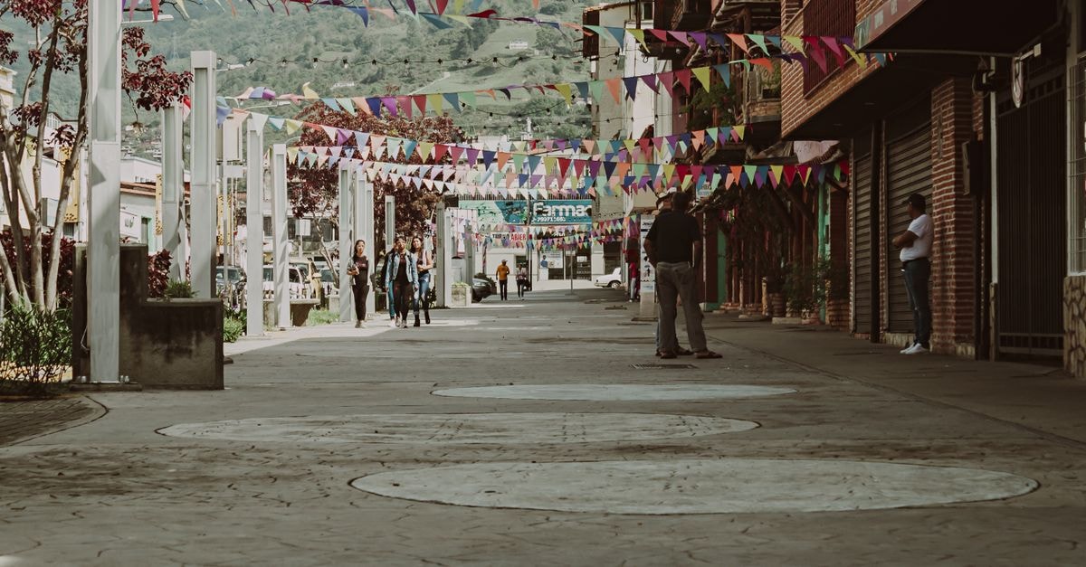 Maracay travel guide: getting a feel for Venezuela's garden city Bustling street scene with vibrant banners in Mérida, Venezuela, showcasing local life and culture.