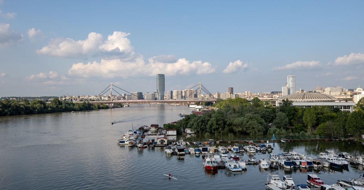 Hostel Sova, Novi Sad — Family-Run Hostel a Minute from the Main Square A serene scene of Belgrade's skyline and marina on the Sava River under a clear blue sky.