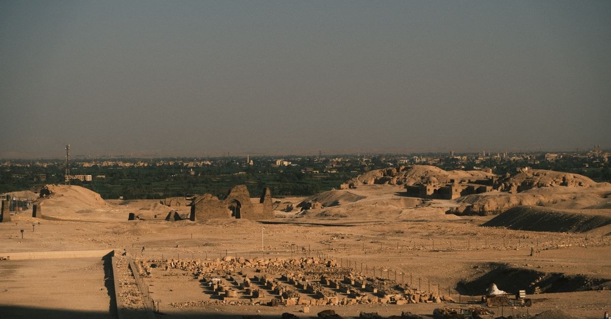 Capture of ancient ruins in Luxor, Egypt at dawn, featuring historical landmarks under soft light.