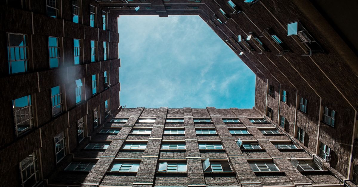 Looking up at a high-rise building creating an abstract sky view in Masvingo, Zimbabwe.