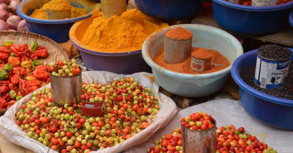 Luena Travel Guide: Markets, Roads, and Wider Angola Flavor Colorful spices and fresh produce beautifully arranged at an outdoor market.