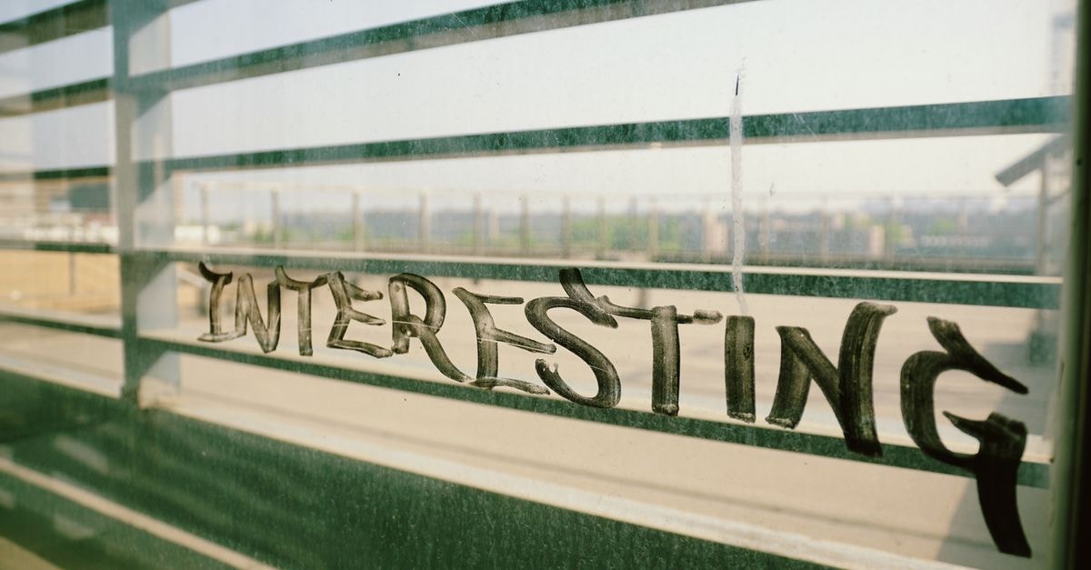 Urban graffiti on a window overlooking Xi An cityscape, capturing gritty textures and urban vibe.