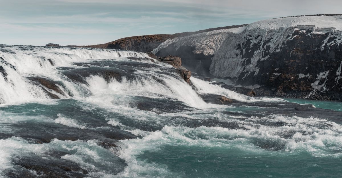 A Sarpsborg travel guide: rivers, waterfalls, and slow Nordic days Discover the dramatic beauty of an Icelandic waterfall cascading powerfully over icy rocks.