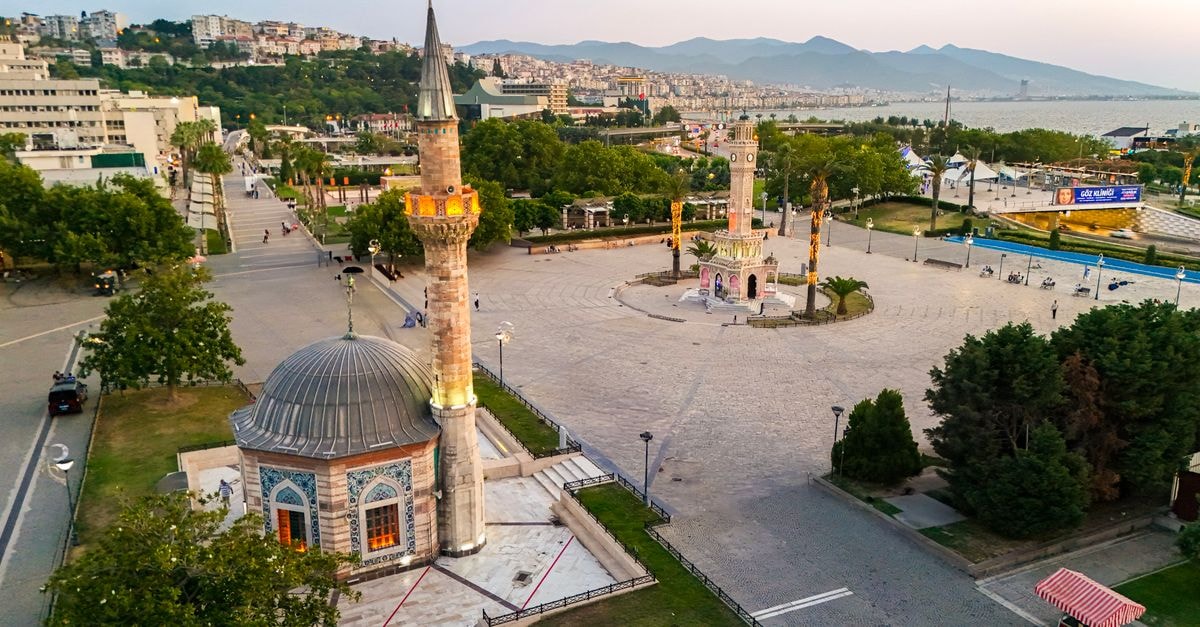 Konak in Konak: Ottoman Heritage and the Identity of a Storied District Aerial shot of Konak Square and the iconic Clock Tower in İzmir, Türkiye during twilight.
