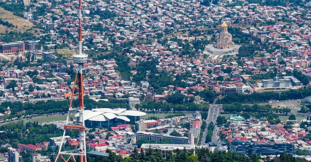 Coyaba Beach Resort in St. George's: Arawak-Inspired Retreat Near Grand Anse Stunning aerial shot of Tbilisi featuring the TV tower and Holy Trinity Cathedral.