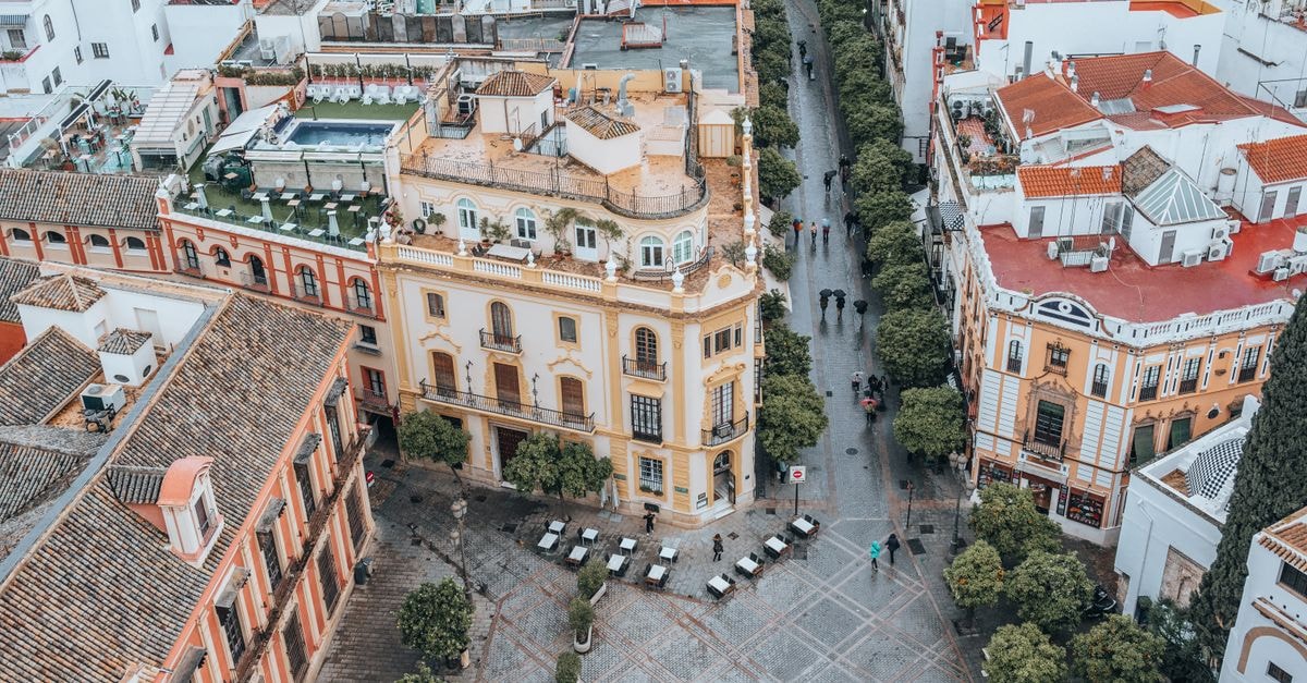 Explore the stunning aerial view of Seville's historic cityscape featuring unique architecture and vibrant streets.