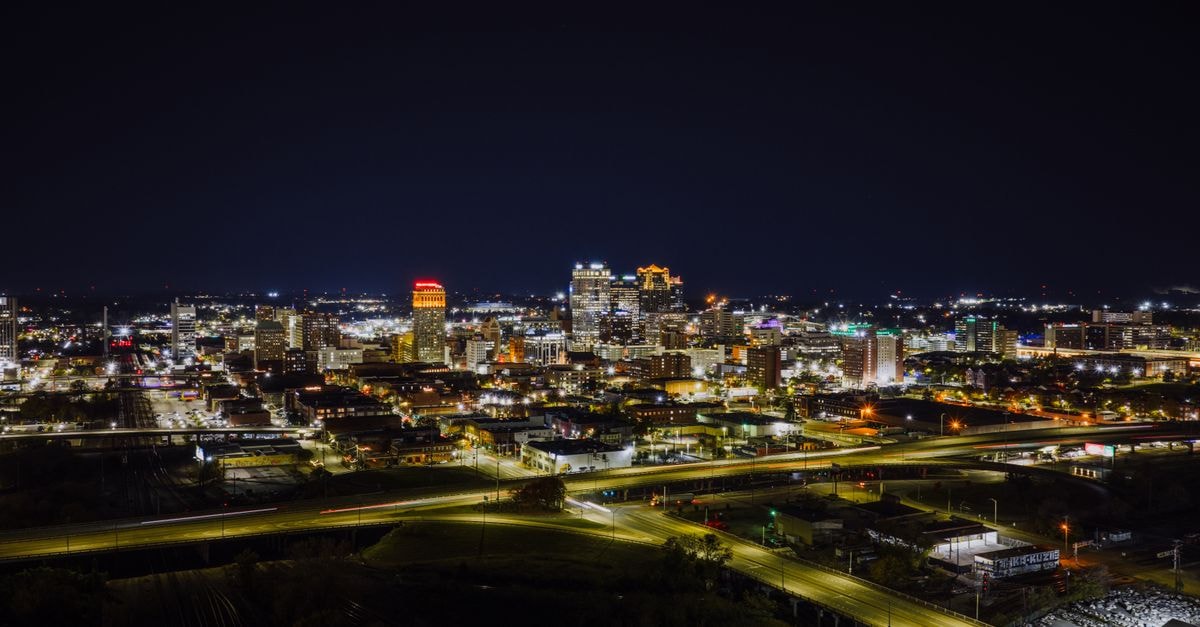 The Briar Rose, Birmingham: A City-Centre Base on Bennetts Hill Stunning aerial night view of Birmingham, Alabama skyline with city lights.