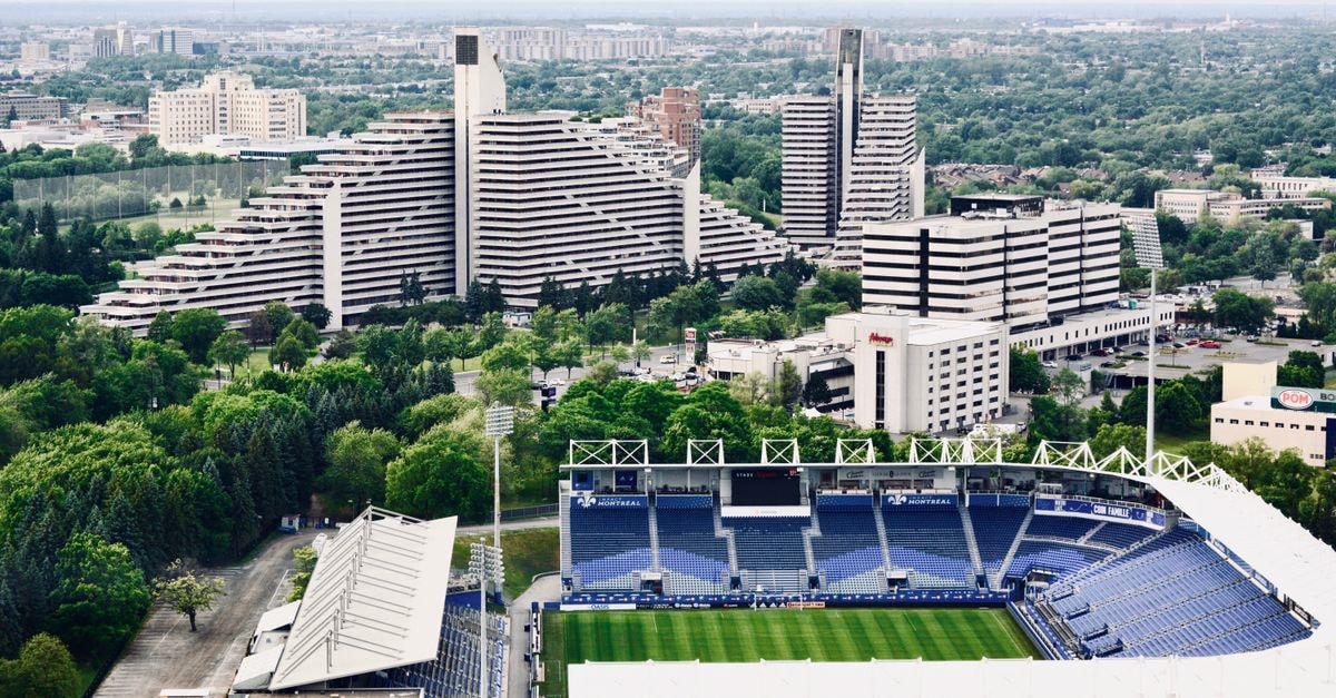 Albergue Provincial N°5009 in Rawson: Avenida Centenario Address Detailed aerial view showcasing city buildings and a prominent football stadium.