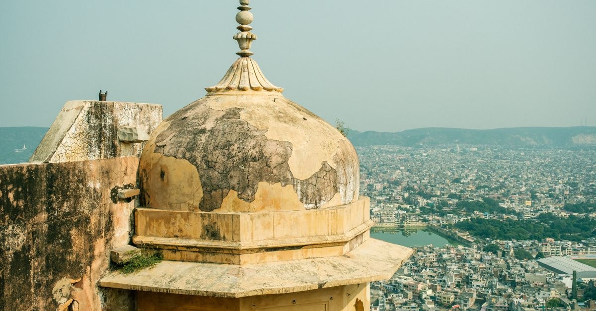 Alwar Travel Guide: Forts, Lakes and Rajasthani Flavors A historic dome in Jaipur offering a panoramic view of the bustling cityscape.