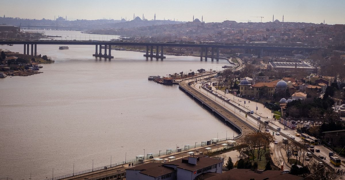Hotel Berr in Fatih: Akdeniz Caddesi Address and Official Snapshot Drone shot of Golden Horn with Istanbul's skyline and bridges under bright sunlight.