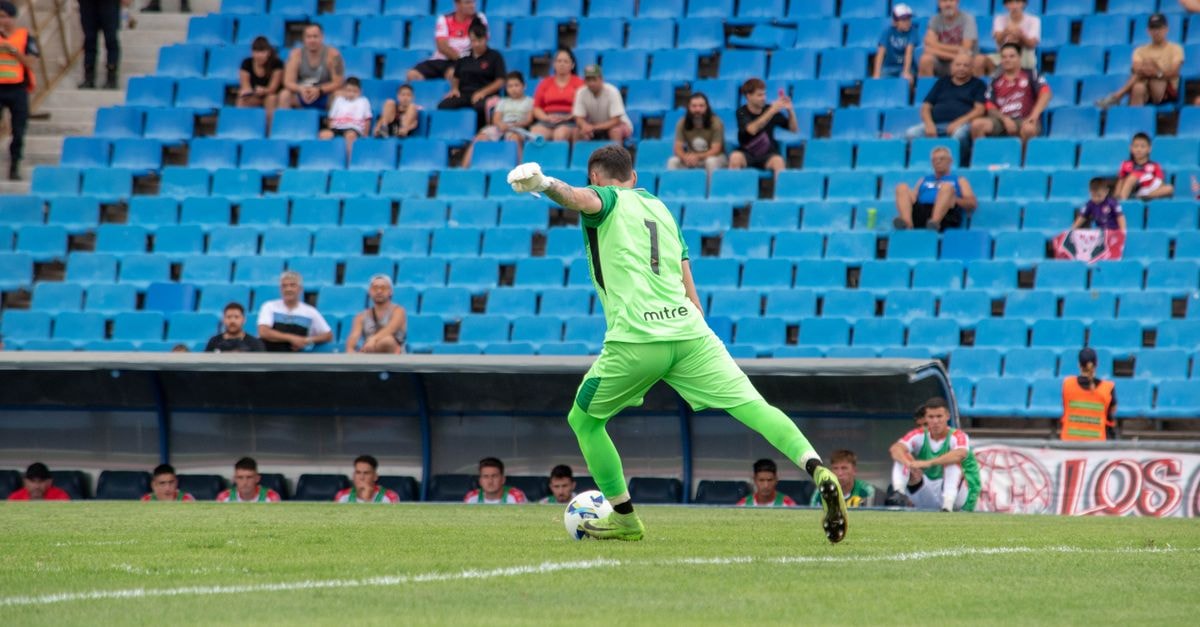 Messi Agrees in Principle to Buy LaLiga 2 Side CD Eldense Goalkeeper in green jersey kicking the ball during a soccer match with spectators in a stadium.