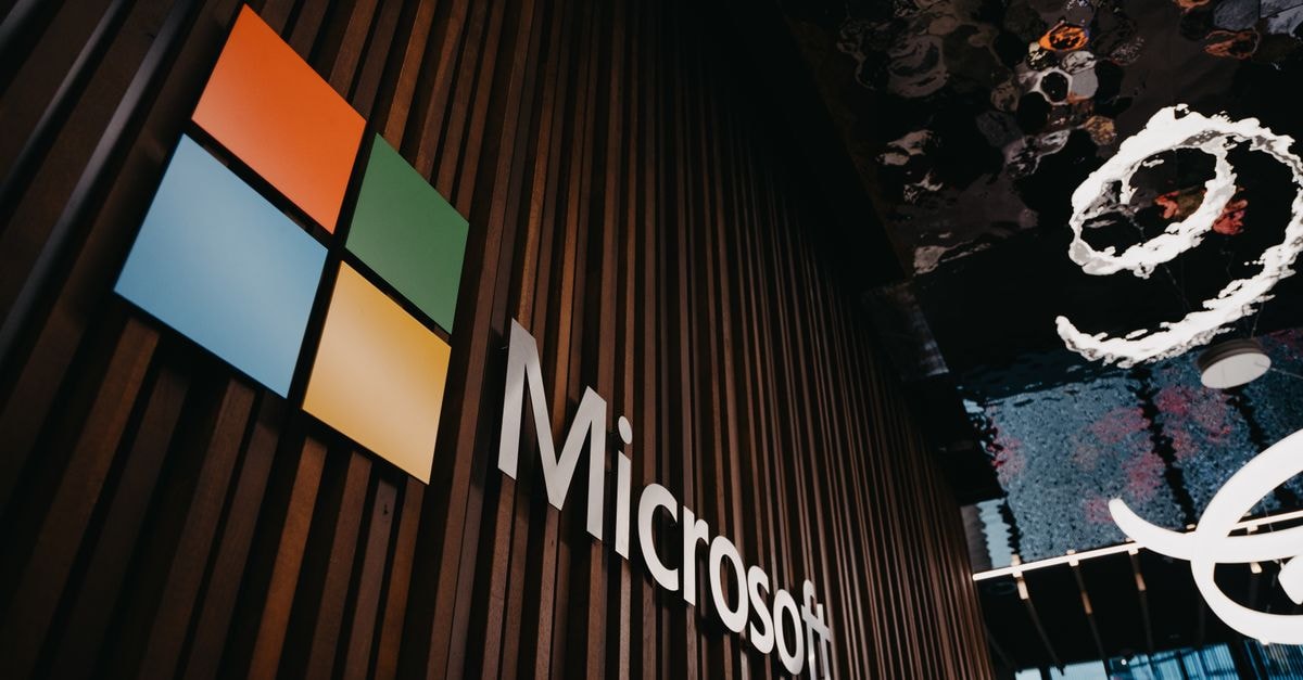 Analysts Lift AMD Targets as Helios AI Platform Draws Microsoft, Anthropic Backing Interior view of Microsoft office with logo on wooden wall in Brussels, Belgium.