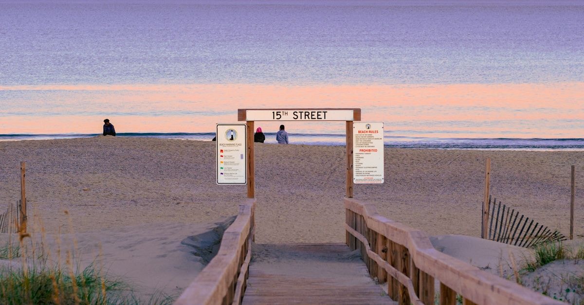 Idyllic sunset view from 15th Street beach with pastel colors and relaxed atmosphere.