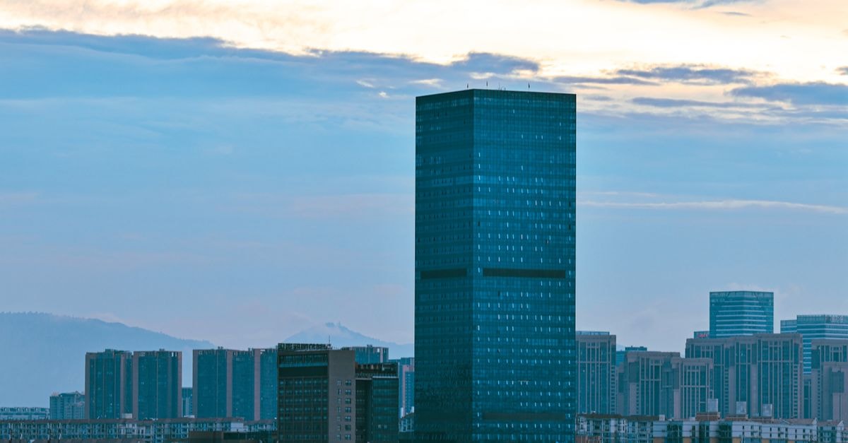 Jianyin Hotel in Xining: Central West Street Stay with Plateau Comfort A dynamic city skyline featuring high-rise buildings and skyscrapers during twilight hours.