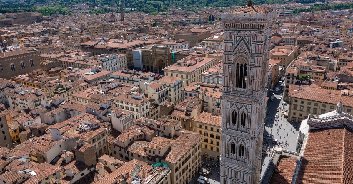 Albergo Firenze in Florence: A Piazza Donati Stay Near the Donati Tower A stunning aerial view of Florence showcasing Giotto's Bell Tower and the bustling cityscape.