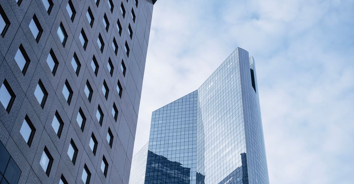 Contemporary skyscrapers with glass facades in an urban downtown area.