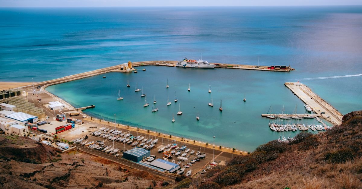 Jamestown Travel Guide: A Slow Day on Saint Helena A captivating view of yachts in a tranquil coastal harbor with clear waters.
