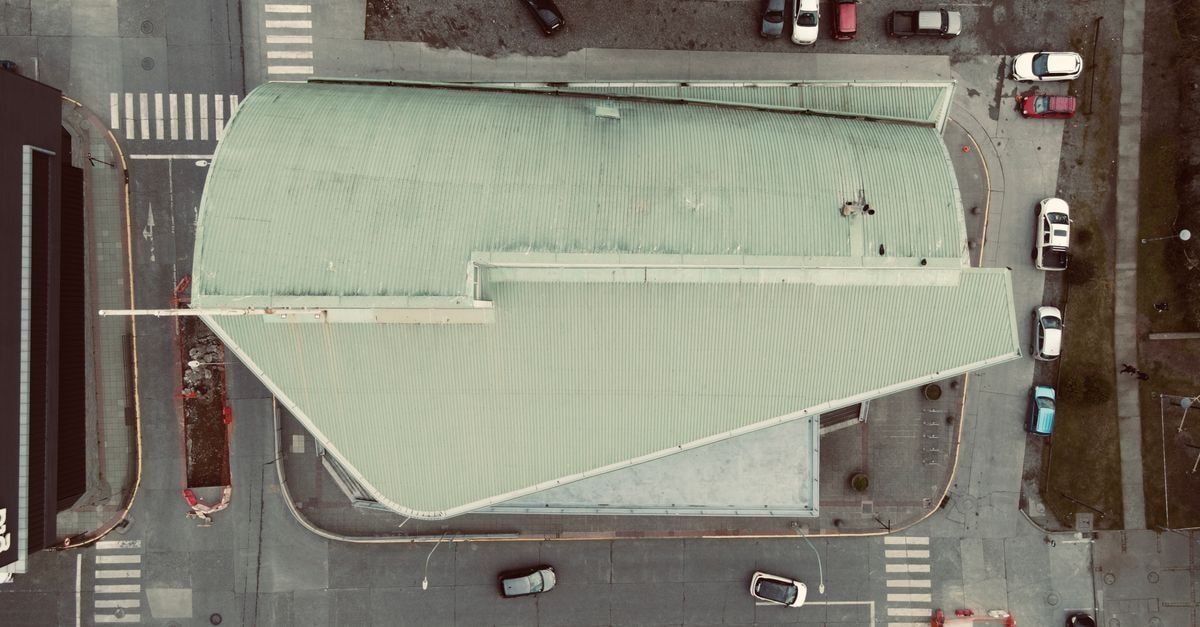 Hotel Gran Casino, Los Teques: A Central Stay Near the Metro Overhead shot of a city intersection and building with parked cars, creating geometric patterns.