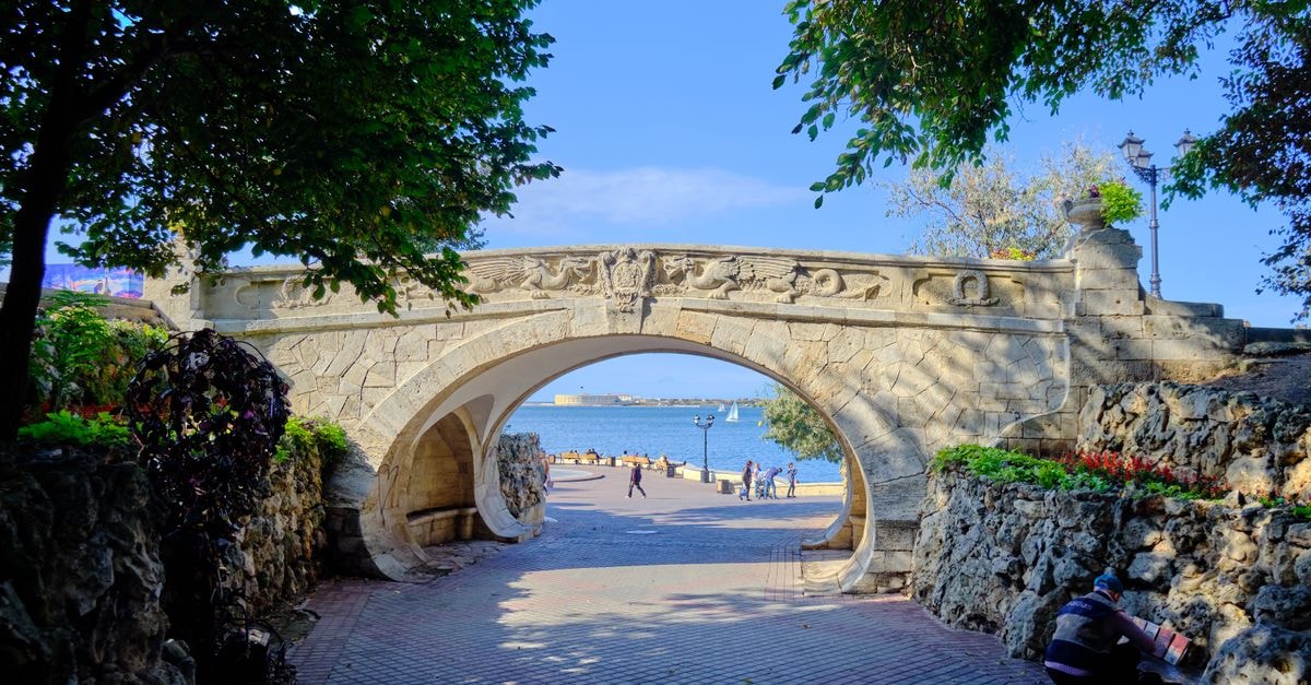 Sevastopol Travel Guide: Planning Tips, Costs and Things to Do Discover the iconic Lovers Bridge in Sevastopol with a picturesque view of the Black Sea.