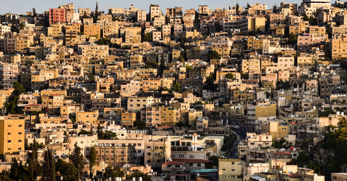 An elevated view of Amman's densely packed buildings capturing the warm urban landscape.