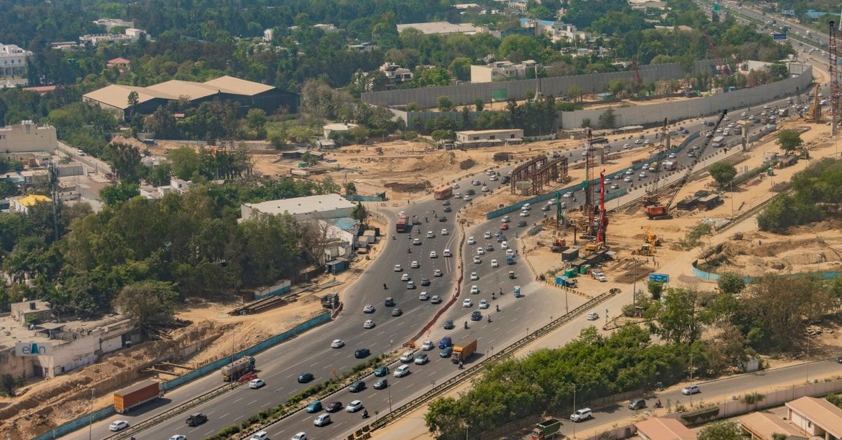Hotel Avanti in Rawalpindi: A Quick Stop Near Kamran Chowk Aerial shot of busy expressway in New Delhi, showcasing traffic and city development.