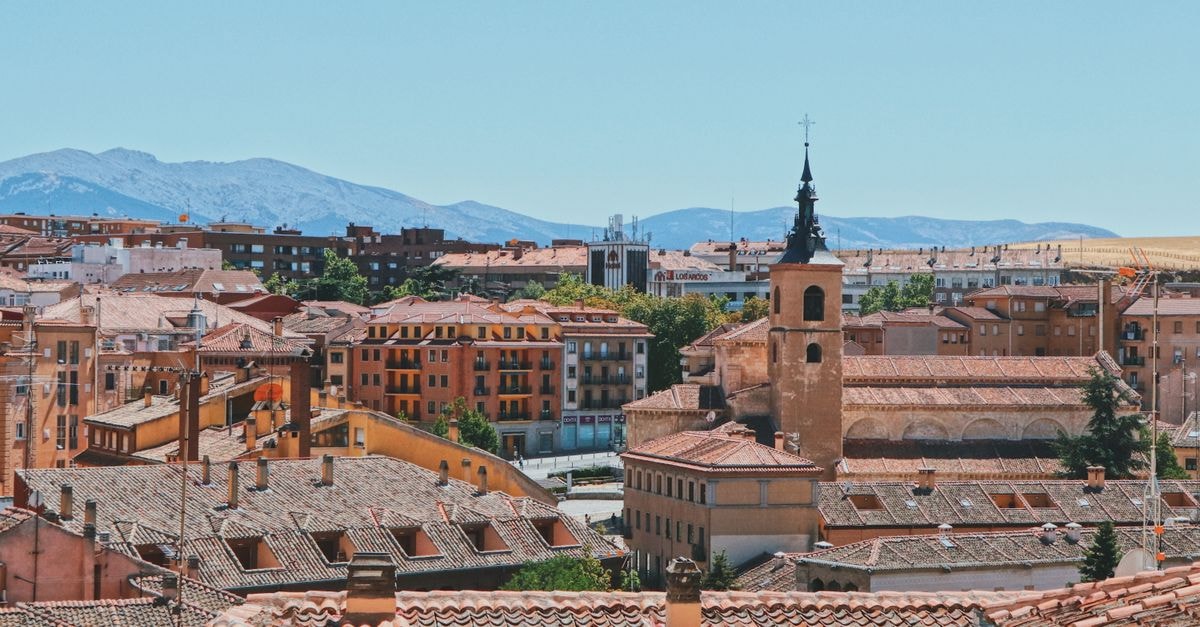 Eurostars Valladolid: A Central Stay on Constitution Street Charming view of Segovia's rooftops and historic church under a clear sky.