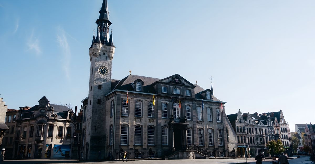 Arnhem Travel Guide: Planning Tips, Costs and Things to Do Beautiful view of a Gothic-style town hall and square on a clear day.