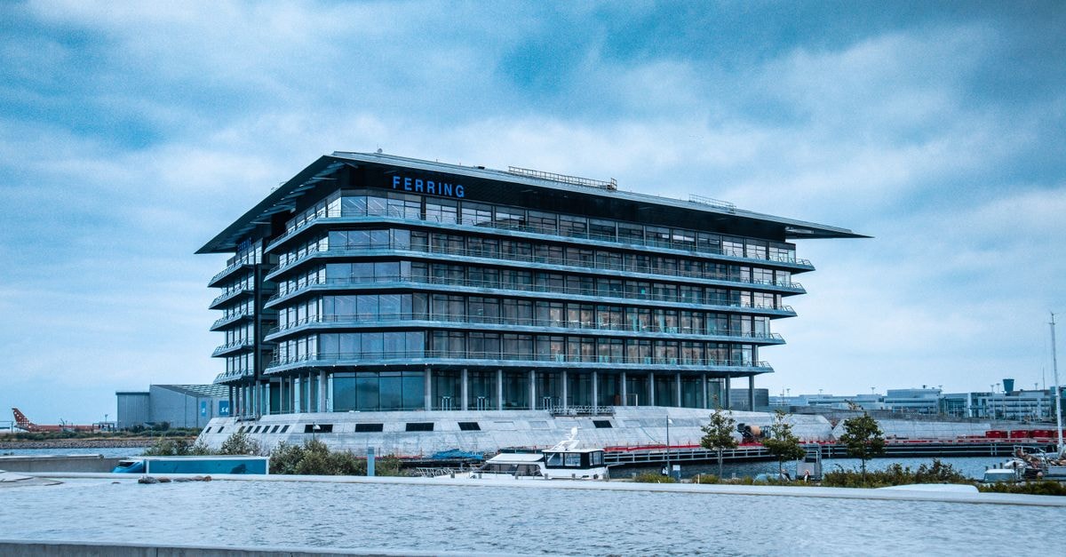 Onterris: Recurring Environmental Demand Meets One Bad Quarter and a Heavy Balance Sheet Contemporary glass office building under cloudy sky in urban waterfront area.