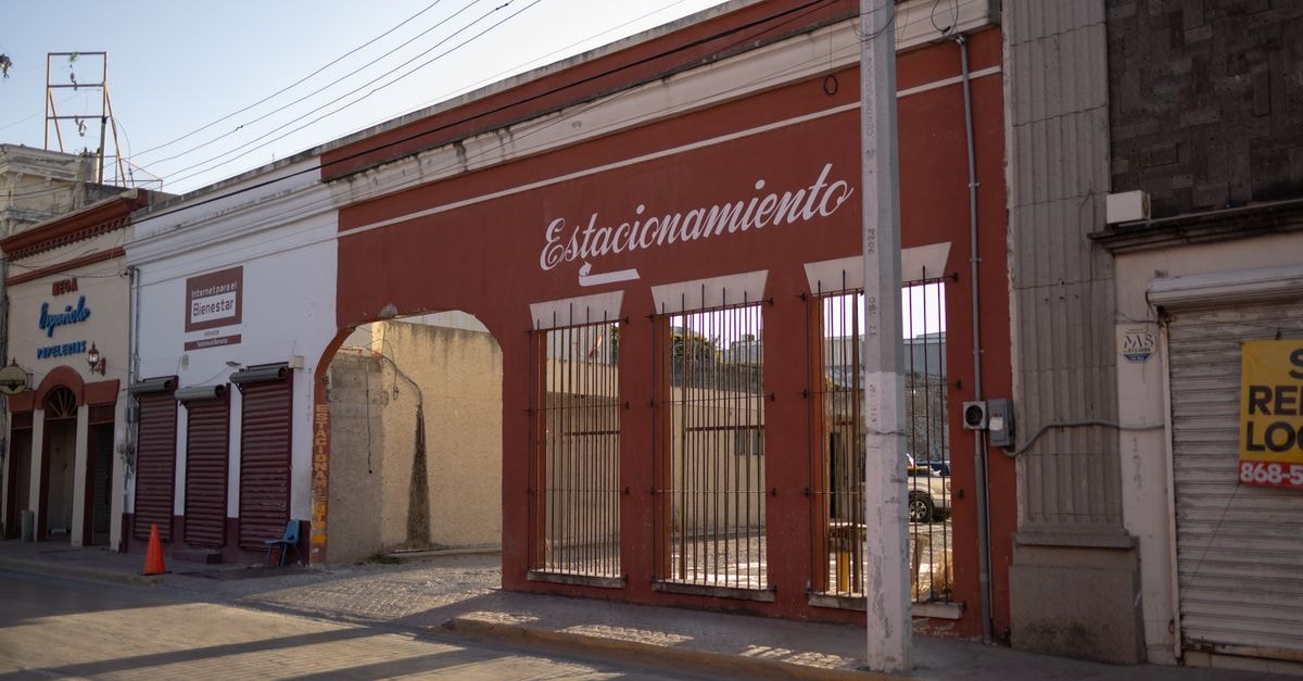 View of a traditional street scene in Heroica Matamoros, showcasing vintage architecture and cultural charm.