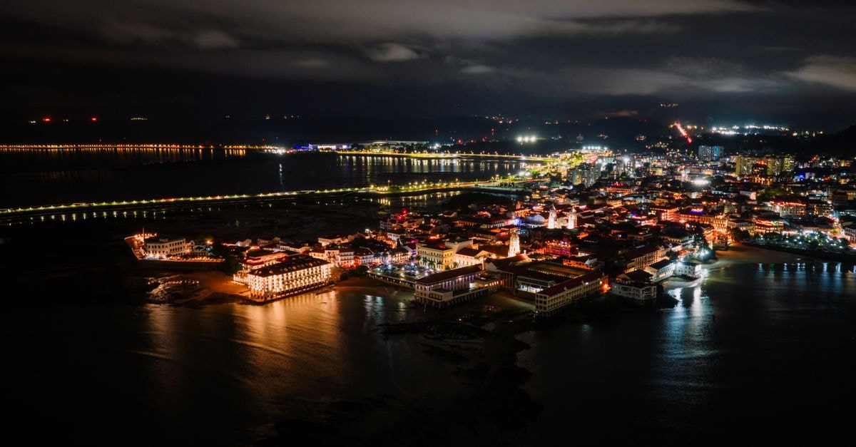 Rumoh PMI Hotel, Banda Aceh — A Quiet Stay in the Baiturrahman District Captivating aerial night view of Panama City's illuminated waterfront with city skyline against the dark sky.