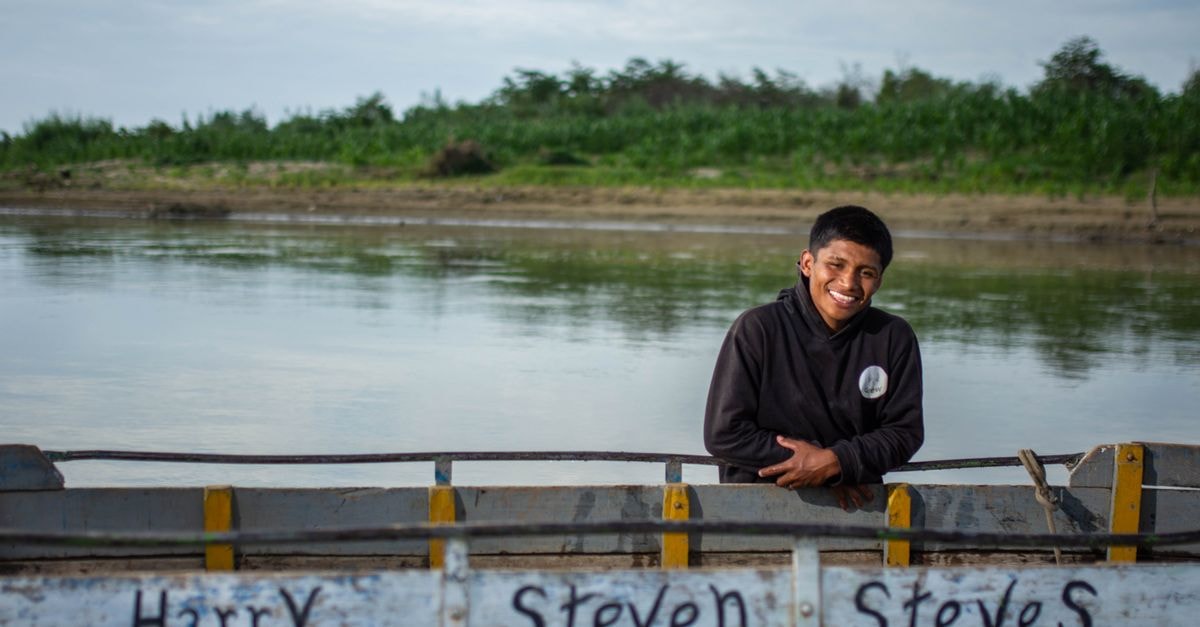 President Hotel in Piura: A Heritage Centre Address A cheerful young man on a boat by the riverbank in Tambo Grande, Piura, Peru.